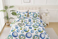 Bed with circular patterned bedding in a bright bedroom