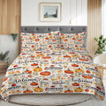 Bedding set with autumn-themed design featuring pumpkins and fall phrases on a bed in a bedroom.