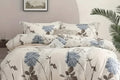 Floral patterned bedding set on a bed in a bedroom setting.