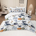 Halloween-themed bedding set with ghosts, pumpkins, and witches on a bed in a bedroom.