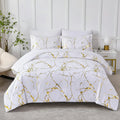 Marble-patterned comforter set on a bed in a bedroom setting.