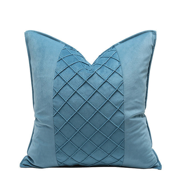 Blue decorative pillow with a textured pattern on a white background