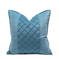 Blue decorative pillow with a textured pattern on a white background